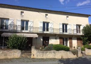 a large white building with balconies on it at Chambres d'hotes du Domaine Capiet in Courpiac