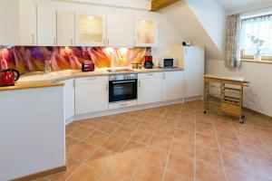 Kuchyň nebo kuchyňský kout v ubytování Ferienwohnung Dreimaster W2 + 18 fotografií