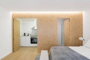 a bedroom with a wall covered in cork at Dom Pipas Houses - Batista & Marcelino Lda in Sintra