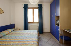 מיטה או מיטות בחדר ב-Casa degli Agrumi