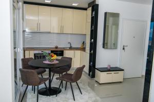 Kuchyň nebo kuchyňský kout v ubytování Lorena Luxury Apartment
