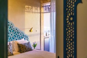 Postel nebo postele na pokoji v ubytování The Way Inn - Boutique Suites