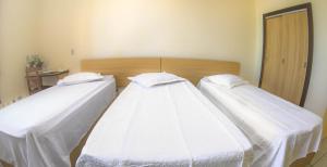 Ein Bett oder Betten in einem Zimmer der Unterkunft Antico Plaza Hotel