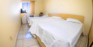 Ein Bett oder Betten in einem Zimmer der Unterkunft Antico Plaza Hotel