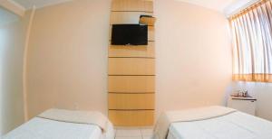Ein Bett oder Betten in einem Zimmer der Unterkunft Antico Plaza Hotel