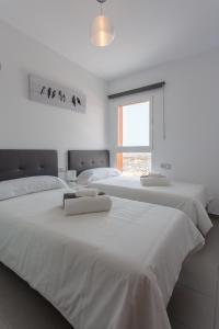 Posteľ alebo postele v izbe v ubytovaní Mariposas Home Pool