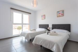 Posteľ alebo postele v izbe v ubytovaní Mariposas Home Pool