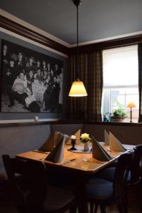 a dining room table with laptops on top of it at Landgasthof Hüttenschenke in Kirchen