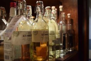 a bunch of bottles of wine on a shelf at Landgasthof Hüttenschenke in Kirchen