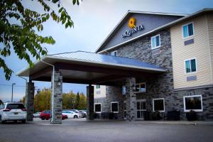a front view of a hotel with a parking lot at La Quinta by Wyndham Fairbanks Airport in Fairbanks