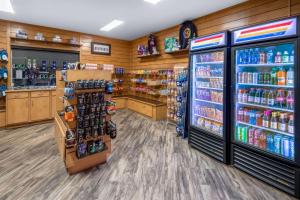a store aisle with a lot of soda bottles at La Quinta by Wyndham Fairbanks Airport in Fairbanks