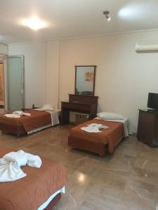 Postel nebo postele na pokoji v ubytování Apollo Hotel