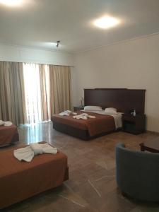 Postel nebo postele na pokoji v ubytování Apollo Hotel