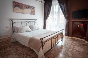 A bed or beds in a room at Civico 8 B&B - Appartamento