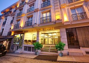 a hotel building with a sign on the front of it at Ayasultan Hotel in Istanbul