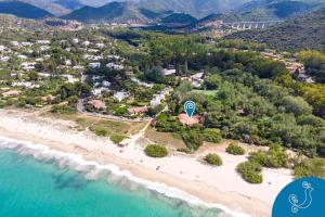 an aerial view of a beach with a resort at Villa Turchese - Exclusive dimora on the beach in Geremèas