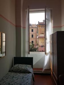 Säng eller sängar i ett rum på Albergo Lungomare