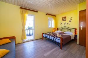 Posteľ alebo postele v izbe v ubytovaní Holiday House K&K