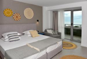 Un pat sau paturi într-o cameră la Hotel Excelsior - All Inclusive