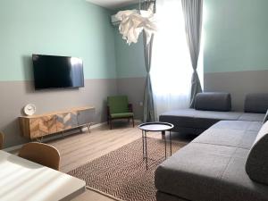 Televízia a/alebo spoločenská miestnosť v ubytovaní Luxury Central Apartment by Carpe Diem