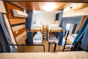 Postel nebo postele na pokoji v ubytování D.C. Inn