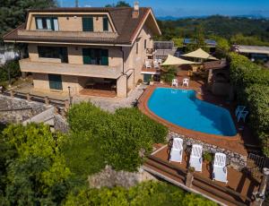 an aerial view of a house with a swimming pool at Villa Cipriano in Minturno