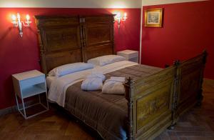 a bedroom with a large bed with two pillows at Villa Cipriano in Minturno +50 photos
