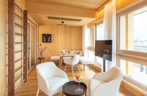 Televízia a/alebo spoločenská miestnosť v ubytovaní MalisGarten Green Spa Hotel
