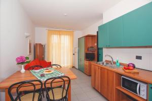 A kitchen or kitchenette at Residence Il Monello