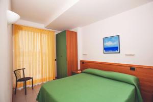 A bed or beds in a room at Residence Il Monello