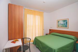 A bed or beds in a room at Residence Il Monello