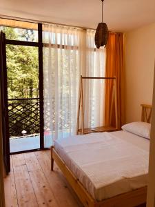 Postel nebo postele na pokoji v ubytování Chalet Kvariati