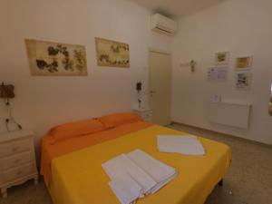 Postel nebo postele na pokoji v ubytování B&B Al Vecchio Olmo