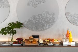 a table topped with plates of food at Kimpton Hotel Palomar Philadelphia, an IHG Hotel in Philadelphia