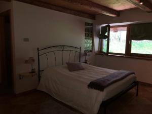 Posteľ alebo postele v izbe v ubytovaní B&B Maso Zont Antico Maso