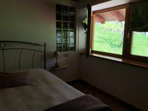 Posteľ alebo postele v izbe v ubytovaní B&B Maso Zont Antico Maso