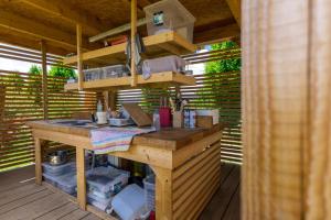 a kitchen on a deck with a wooden counter at Horse Glamping Park in Cirkovce