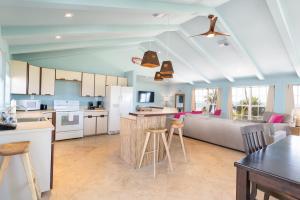 a kitchen with a refrigerator, stove, sink, and dishwasher at Lime Tree Bay Resort in Islamorada