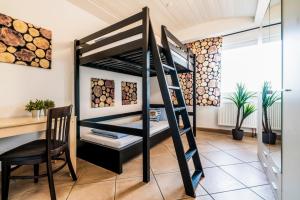 Ein Etagenbett oder Etagenbetten in einem Zimmer der Unterkunft Casa BARvaria