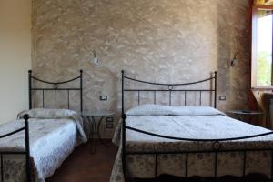 Voodi või voodid majutusasutuse La Sorgente Del Sole toas