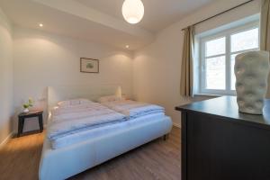A bed or beds in a room at Mairhof