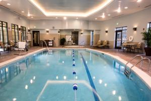 a large swimming pool in a hotel room at Staybridge Suites Albany Wolf Rd-Colonie Center, an IHG Hotel in Albany