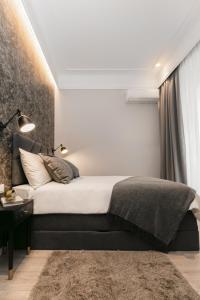 Posteľ alebo postele v izbe v ubytovaní Harbour Residence Apartments