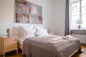 Posteľ alebo postele v izbe v ubytovaní Ego Apartments Old Town