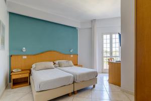Postel nebo postele na pokoji v ubytování Hotel Mandetta - Adults Only