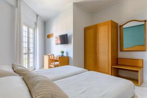 Postel nebo postele na pokoji v ubytování Hotel Mandetta - Adults Only