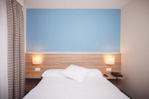 Postel nebo postele na pokoji v ubytování Hôtel de Chailly