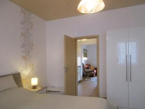 Postel nebo postele na pokoji v ubytování Ferienwohnung Schrammsteine
