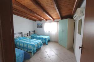 Katil atau katil-katil dalam bilik di Il Canneto di Selinunte