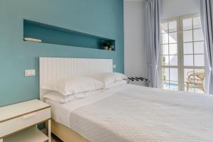 Postel nebo postele na pokoji v ubytování Hotel Mandetta - Adults Only